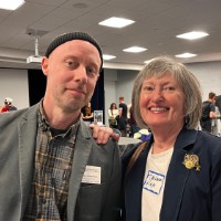 Deb Haveas puts hand on Joel Potrykus's shoulder.